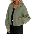 Model wearing the Baltere Baseball Uniform Coat army green, highlighting its casual street style, cropped length, and zippered pockets.