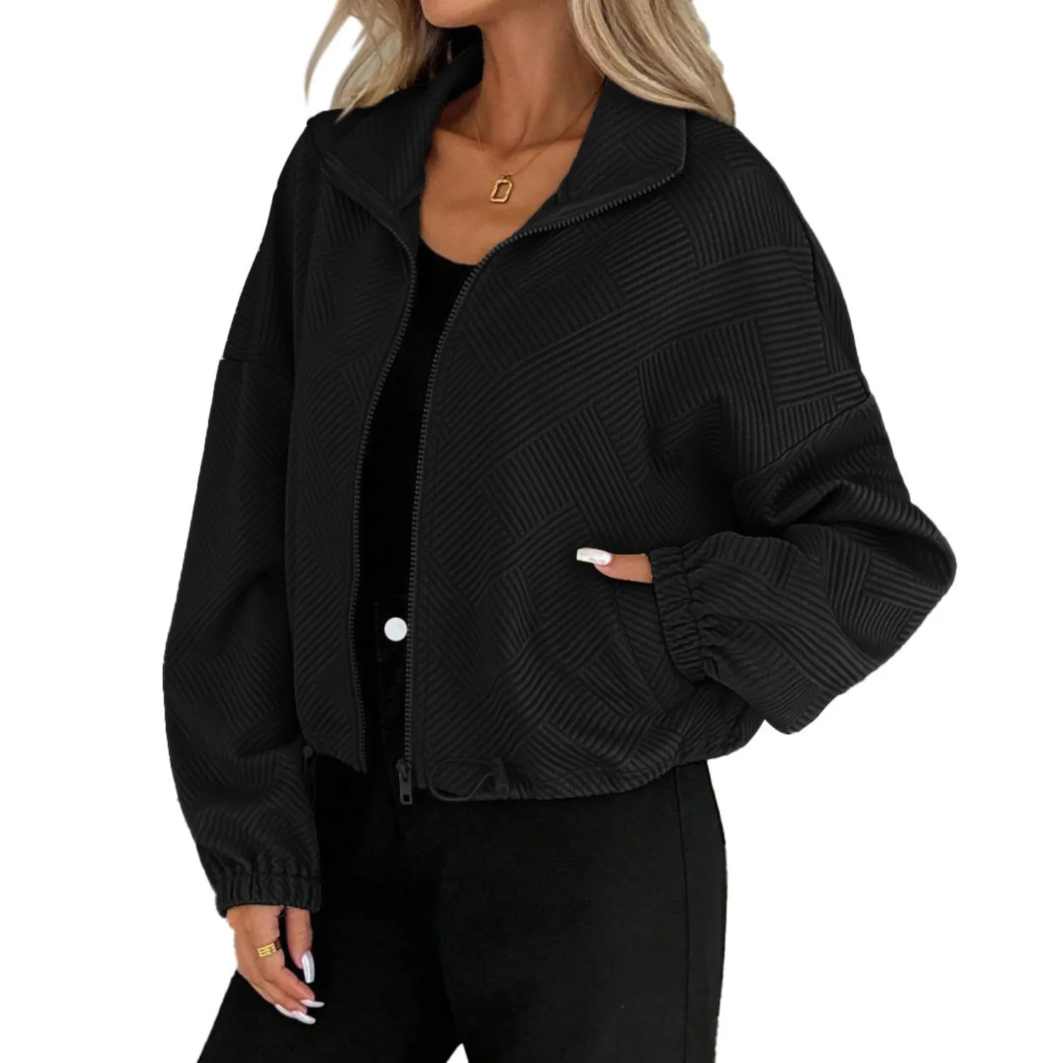 Model wearing Baltere's Loose Baseball Uniform Coat black, showcasing the textured fabric, full-zip front, and comfortable.