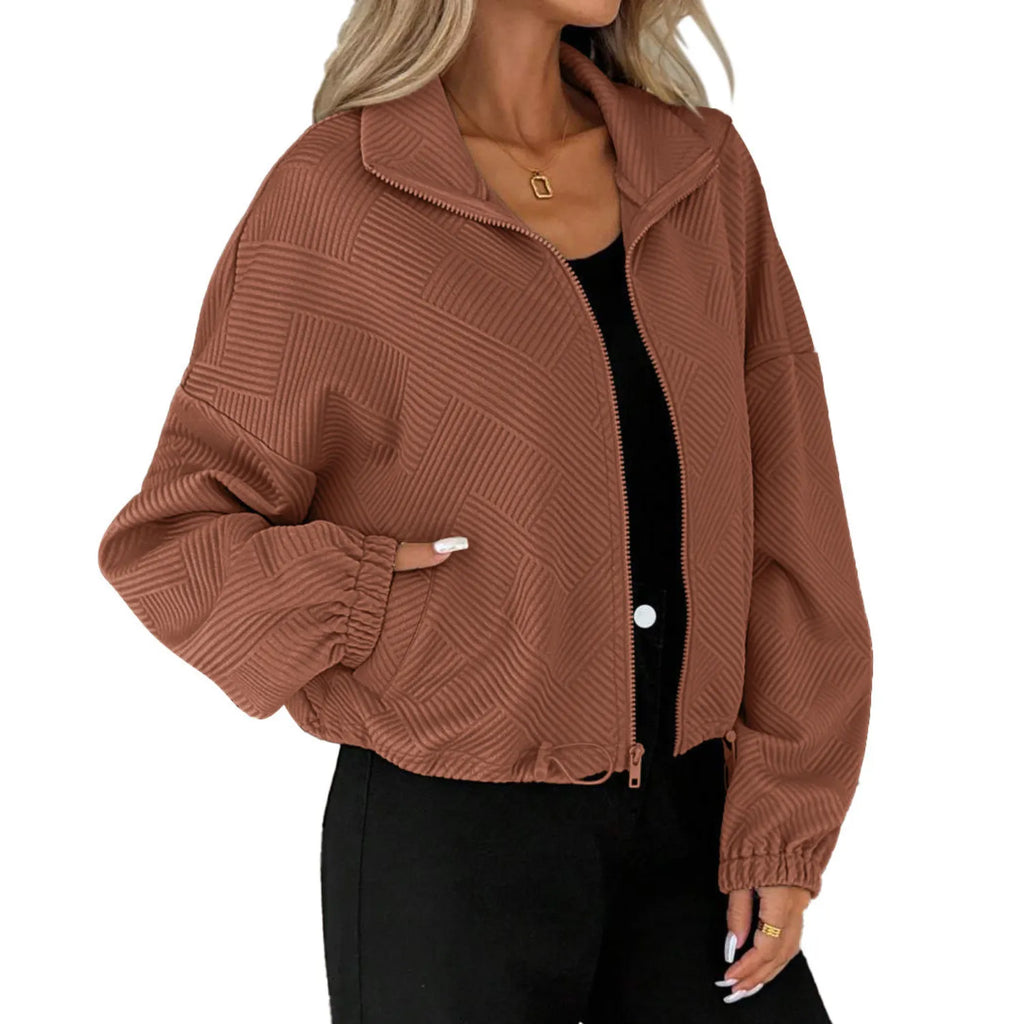 Women's Loose Baseball Coat caramel from Baltere, featuring a high collar, elastic cuffs, and a unique geometric textured pattern.