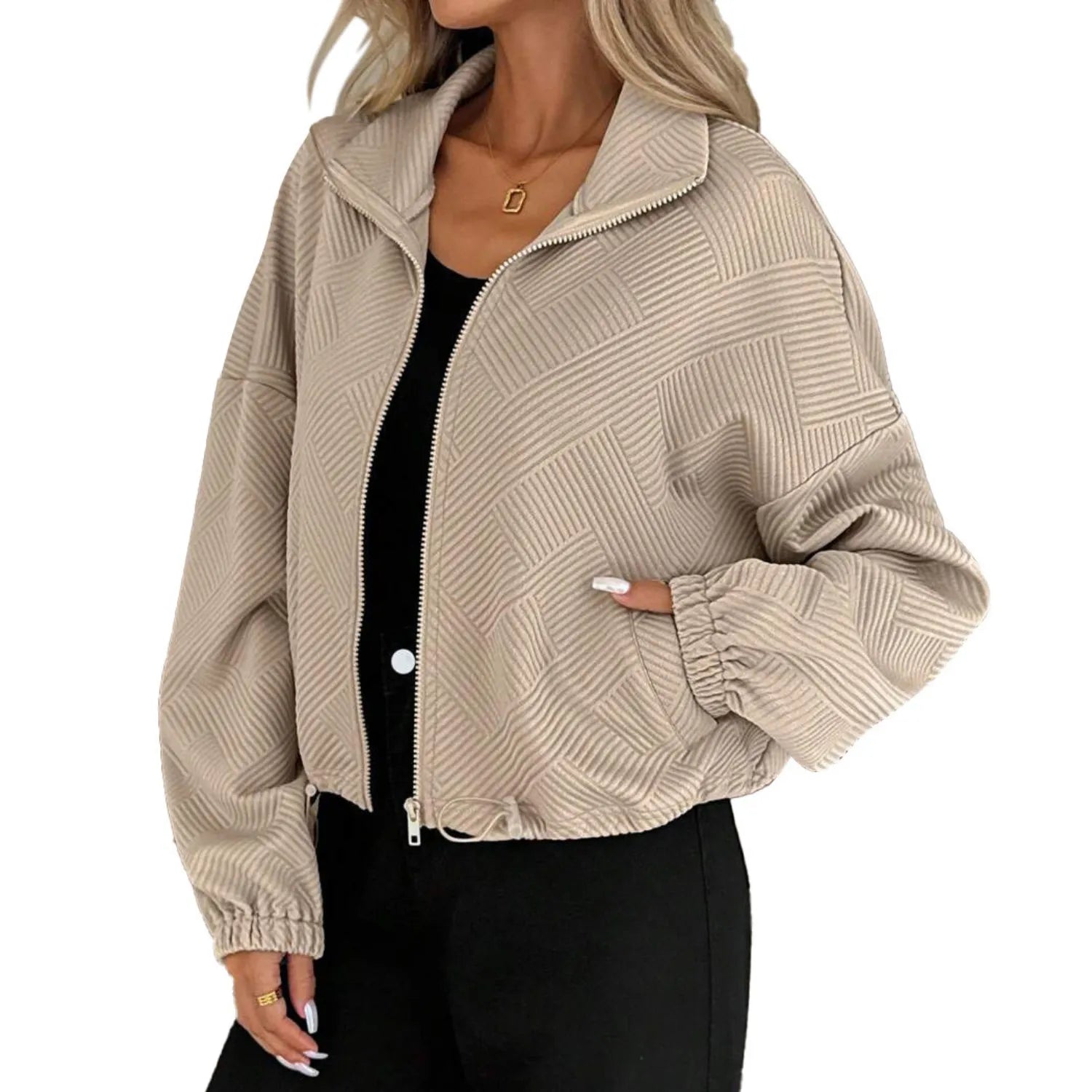 Model wearing Baltere's Loose Baseball Uniform Coat, showcasing the textured fabric, full-zip front, and comfortable, relaxed fit, in khaki.