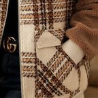 Baltere's Women's Plaid Coat, showcasing its classic pattern, modern and slimming fit.