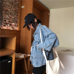 Baltere Women's Retro Denim Jacket, featuring a loose fit, button-up front, and four classic flap pockets.