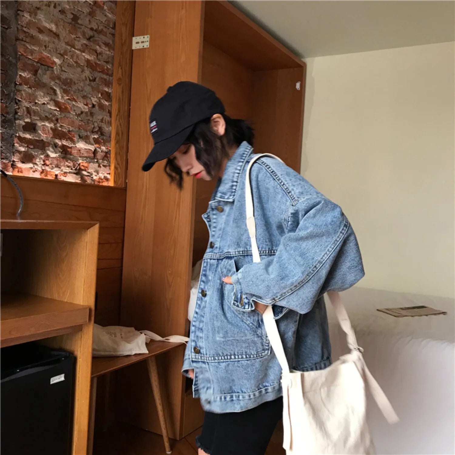 Baltere Women's Retro Denim Jacket, featuring a loose fit, button-up front, and four classic flap pockets.