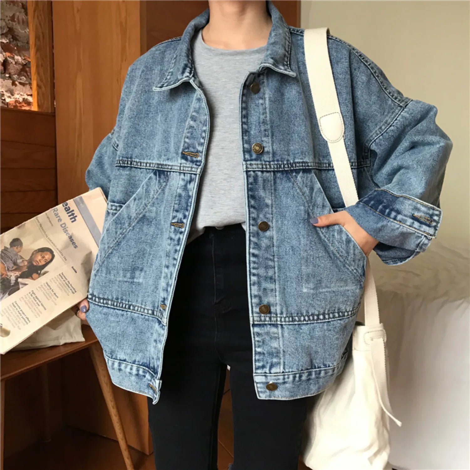 Baltere Women's Retro Denim Jacket, featuring a loose fit, button-up front, and classic flap pockets.