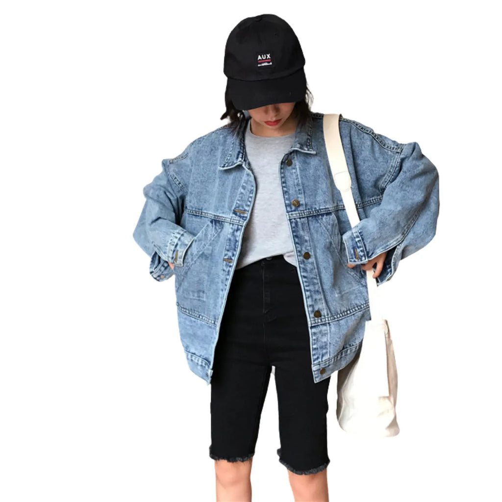 Women's Retro Denim Jacket, featuring a loose fit, button-up front, and four classic flap pockets in blue.