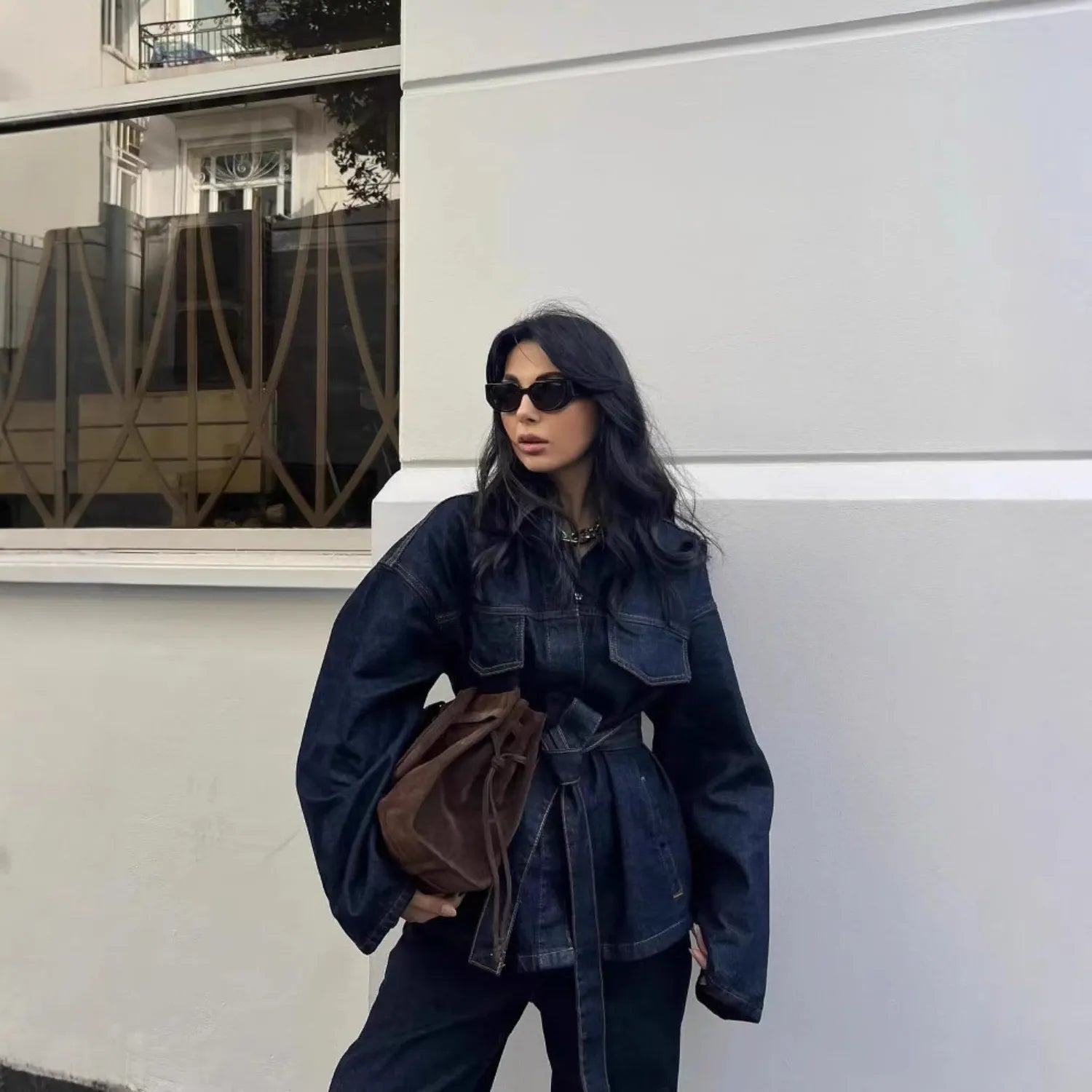 Model wearing Baltere's Women's Retro Denim Jacket and Trousers Set.
