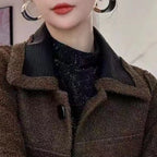Model wearing Baltere's reversible leather jacket, showcasing its oversized collar, and modern silhouette.