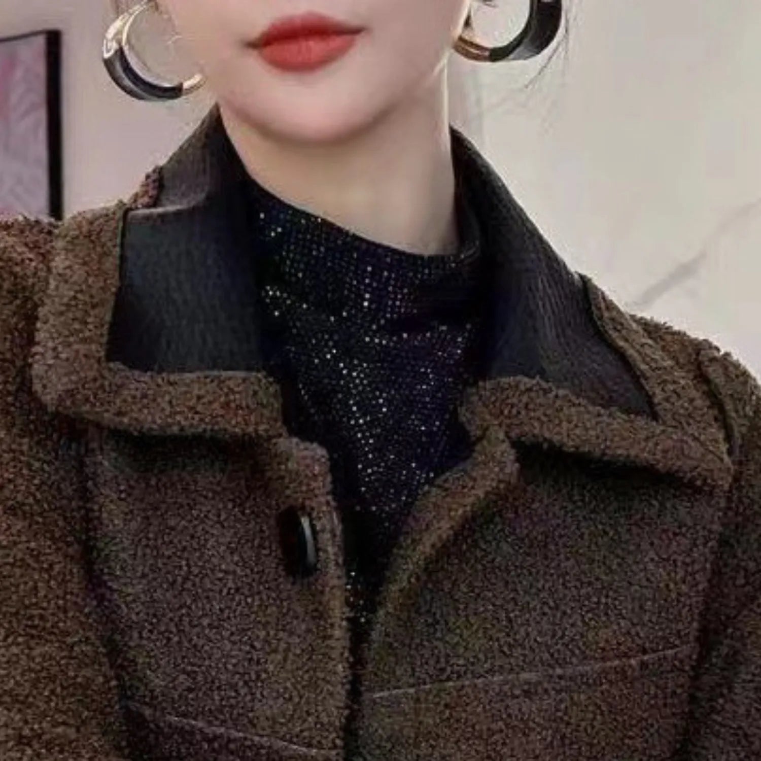 Model wearing Baltere's reversible leather jacket, showcasing its oversized collar, and modern silhouette.