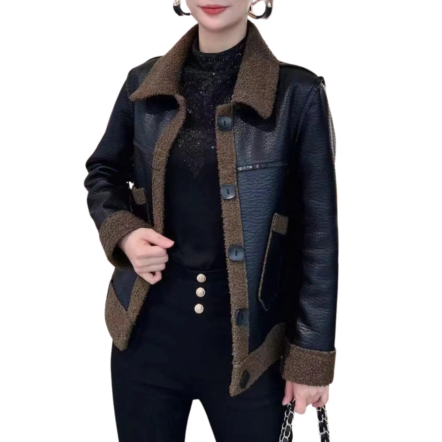 Model wearing Baltere's reversible leather jacket, showcasing its oversized collar, front buttons, and modern silhouette in black and brown.