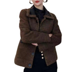 Reversible leather jacket, showcasing its oversized collar, front buttons, and modern silhouette.