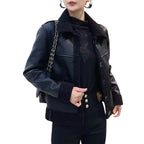 Model wearing Baltere's reversible leather jacket black, showcasing its oversized collar, front buttons, and modern silhouette.
